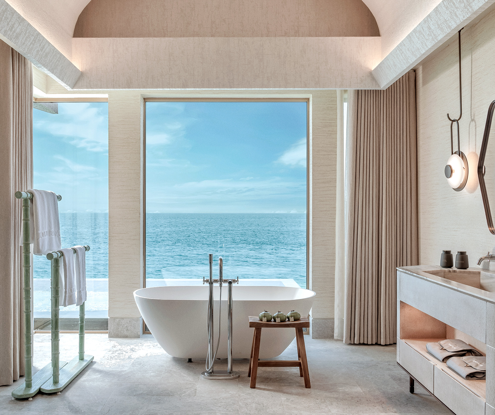 Luxury overwater villa at golden hour